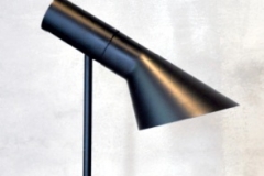 ARNE JACOBSEN AJ Table Lamp Black lacquered metal, base with push button switch Adjustable shade Height 44 cm RM 5,000