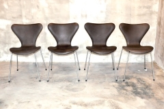 ARNE JACOBSEN Series 7 Chair, Model 3107, Set of 4 Mocha Aniline leather, chrome-plated steel, plastic Signed with molded manufacturer’s mark to frame of each example- [Made in Denmark by Fritz Hansen] 79 x 51 x 47 cm RM 15,000 for a set of four